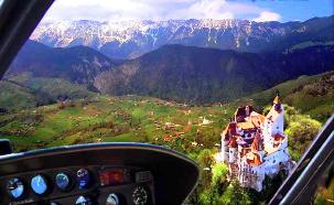 Rent a helicopter and fly over Dracula's Castle